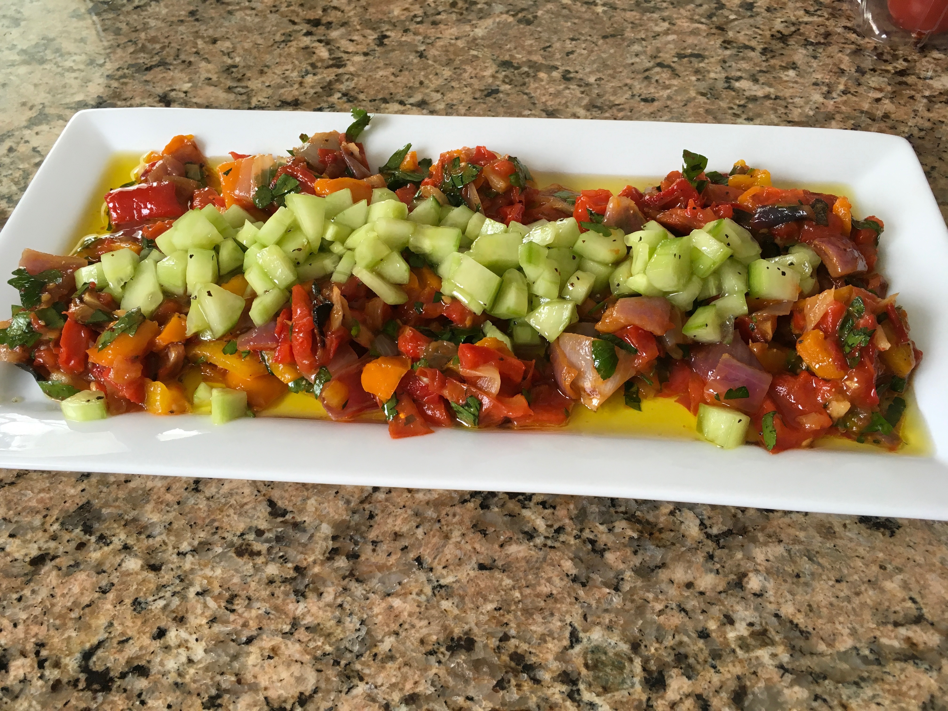 Yotam Ottolenghi’s grilled pepper salad with cucumber and herbs.